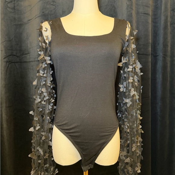 Shop Wanna B Tops - NWT - Black square-neck long-sleeve bodysuit with applique sheer sleeves. Size S